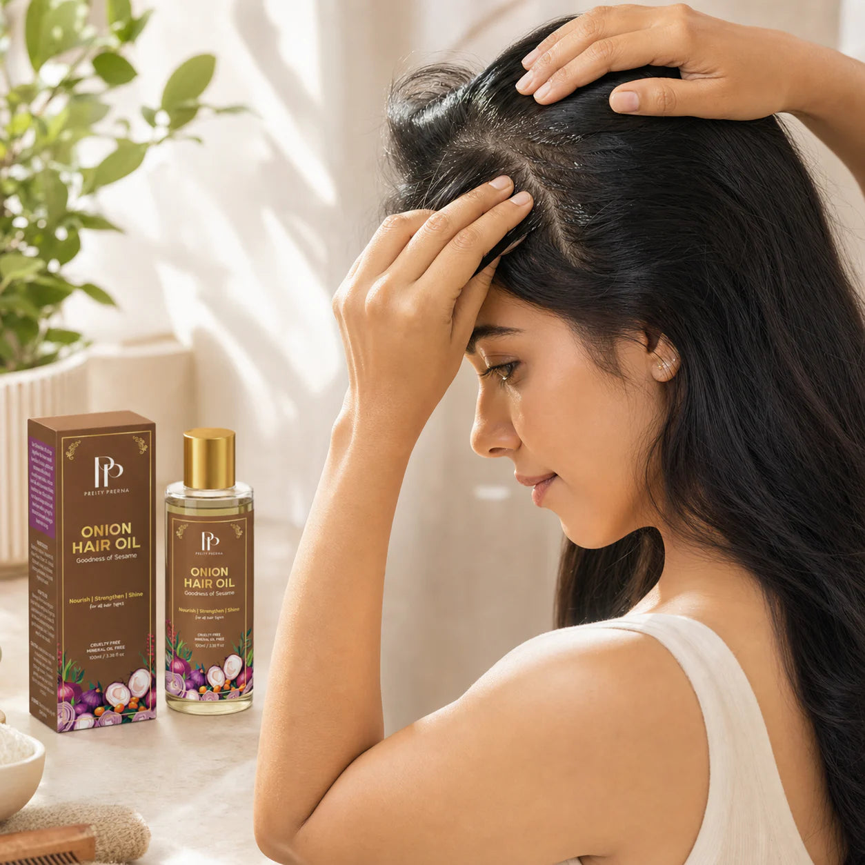 Apply Onion Hair Oil to parted scalp and roots